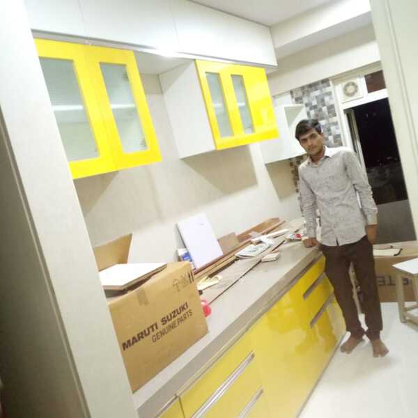 Simply put, acrylic is a non-toxic finish that gives a perfectly smooth texture and a high-gloss appearance to kitchen cabinets. This high-quality synthetic material comes with a perfect mirror-like finish that's shatter-resistant, and also does not chip or crack easily.