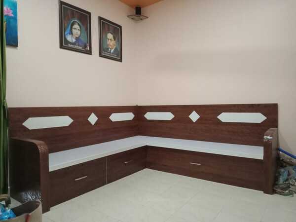 A couch, also known as a sofa, settee, or chesterfield, is a cushioned item of furniture for seating multiple people (although it is not uncommon for a single person to use a couch). It is commonly found in the form of a bench, with upholstered armrests, and often fitted with springs and tailored cushion and pillows.