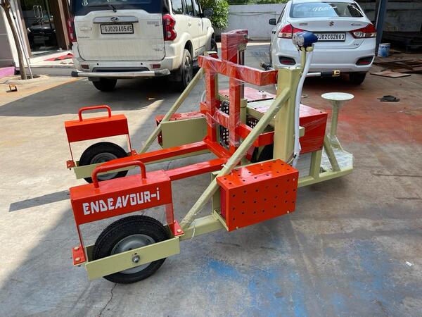 Electric Pallet Transfer Trolley for Bricks Manufacturing IndustryElectric Hydraulic Pallet Trolley • Capacity: 600 Kgs• Lifting Stroke: 250 mm• Wheel: Pneumatic Wheel – 03 Nos• Forward & Reverse Travel by Electric Motor• With Electric Charge Control & Speed Control• Up & Down Operation: Electric Push Button
