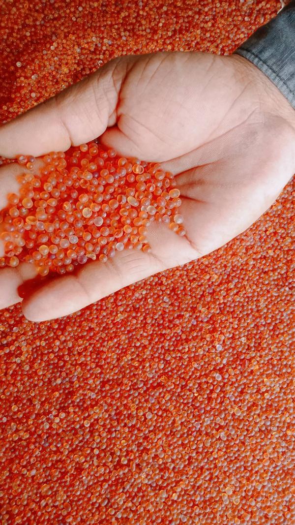 Orange Silica gel is semi-transparent glassy crystals used as moisture absorbent. It appears Orange in color. It also known as self Indicating type Silica gel because When free from moisture the particles are dark orange. As they are put to use, the particles take up moisture, Silica Gel gradually turns Orange-Yellow & then to green and gives a ready indication that it has done or its saturated. Its work and requires replacement or regeneration. In fact, it is mainly used as indicator for the extent of dehumidification and moisture absorption in sealed vessel.