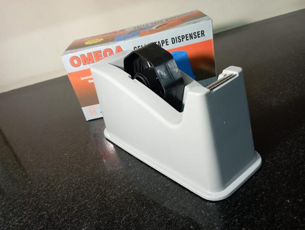 Type: Tabletop dispenserSuitable for: 1” wide tape.Max O.D: 1” core.Tension control No.Pressure roller PlasticBlades Steel Blade.Body: Plastic.Total weight without tape: 850gms.Safety Rating and Feature No.