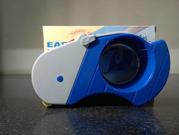Type:	HAND HELD TAPE DISPENCERSuitable for:	2” wide tape.Max O.D:	1”,1&1/2”,3” core adaptable.Tension control	No.Pressure roller	One Rubberized And Plastic.Blades	Triangular Steel Blade.Body:	Plastic.Total weight without tape:  	200gms.Safety Rating and Feature 	No.