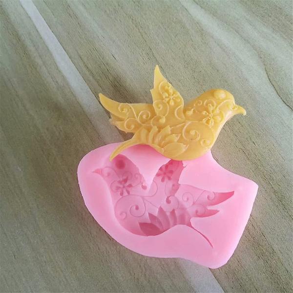 First Try Flying Bird Silicone Mold, Swallow and Peace Dove Soap Mold, Making Cake, Decoration, Chocolate, Polymer Clay, Cupcake Decor, Sugar Craft, Resin Clay Molding Baking About this itemFOOD-GRADE MATERIALS – Our 3D mold completely BPA free, non-toxic and harmless. Heat resistance can reach 446 degrees fahrenheit, cold resistance can reach -40 degrees fahrenheit. 100% Safe to use, microwave safe, oven safe, and dishwasher safe.UNLIKE OTHER SILICONE MOLDS – Our candy ice cube molds are made out of Food-Grade Silicone! It is the highest standard in silicone, Don't be fooled by low cost alternatives which are filled with nasty fillers! Make sure your friends get the best!MULTIPLE USE - Silicone Baking Molds is ideal for use with a wide range of edible and non edible materials; can be used as cake or cupcake decoration, candy melts, Ice Cube, decor and embeds for handmade soap, candle accents, and for clay and epoxy resin jewelry.NON-STICK DESIGN – Simply pour your favorite ingredients in the mold, prepare, and cool completely. Compared with conventional stiff cube molds, our silicone trays are real easy to release ices. Because it is softer, you only need to push the bottom of the molds, and then the ice cubes and balls get out easily.NICE GIFT - They are DIY cake baking molds, you can have a good time with your family or friends and get a caking skill by making fondant, candy or decorating cake together; That is a nice gift for friends and familyProduct descriptionYou can using this DIY mold making yourself delicious pastry, cakes, cake decorations, candies, ice cream, candles, soaps, biscuits during Thanksgiving day, Christmas, birthday or family dinner.Feature: Temperature resistance wide range. It can be used within between -40?~230?, suitable for microwave oven, oven, refrigerator.Dove Shape Mold Candy Chocolate Cake Decorating Molds- This mold is well made and detailed.- Soft and easy to handle for the beginners.- Reusable & durable, have a relatively long life cycle.- This silicone molds makes your baking more novel, not like former cupcake baking mold which is unchangeable in the pattern.Tips:- NO direct contact with open fire.- Forbid a stronger impact force and scratching with sharp items.- Store it in a dry place instead of wet environment, protected from sunlight.- Do not use sharp or abrasive objects to wash it ( steel wool, for example).