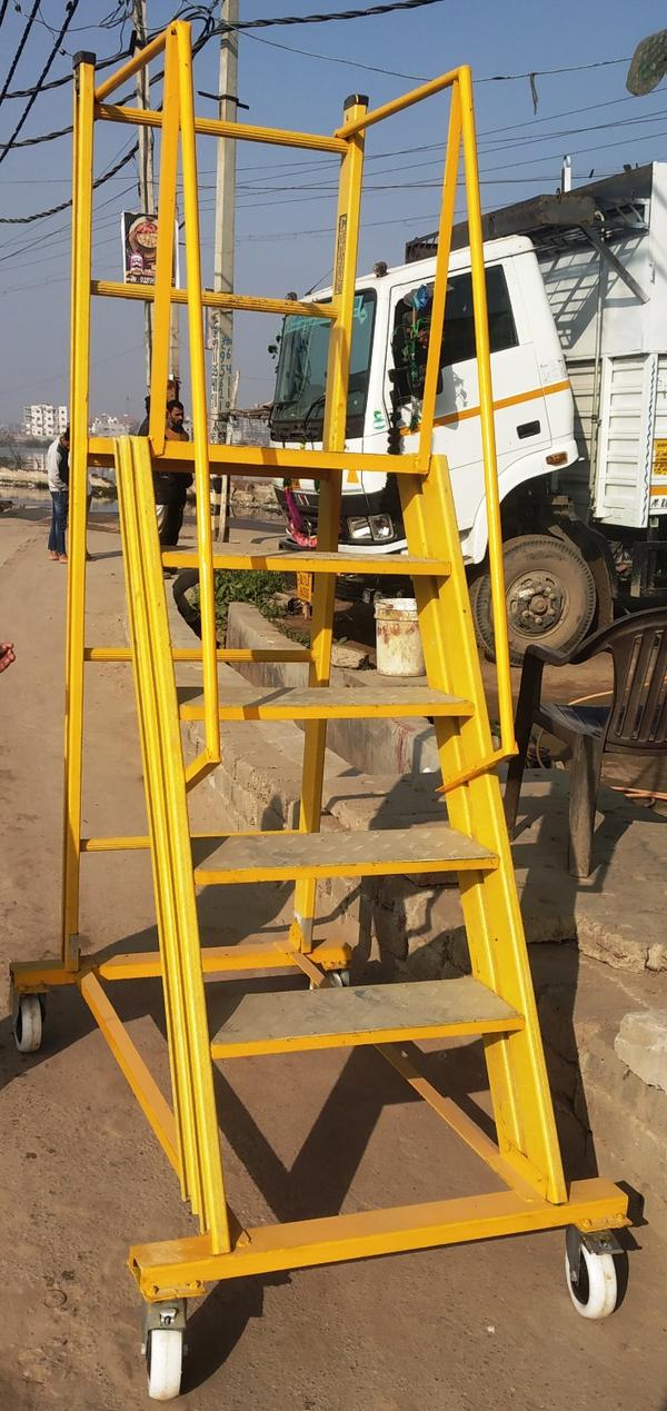 FRP TROLLY LADDER, This is a fiberglass trolley ladder which is very useful in electrical work. The platform size of this ladder is 2x2 feet which is enough to do the work. You can take any size of this ladder up to 13 feet for more details you can contact.