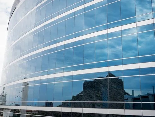 Window, glass and glazing services install glass windows, blocks, doors, walls, and other architectural elements. Some companies also design and install custom glass surfaces and mirrors. Glass windows are used in most residential, commercial, and industrial buildings and differ in terms of shape, size, and type.