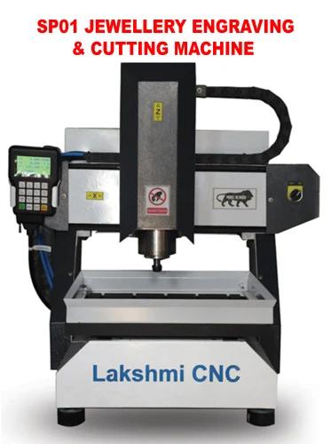 We are a leading Manufacturer of Lakshmi CNC Gold & Silver Engraving Machine processing with stepper motor. Also we are making of laser cutting machine, metal die engraving machine, metal die milling machine, single and double & four head wood carving machine,  metal, non metal laser cutting machine, wood turning lathe machine manufacturer in Coimbatore, Tamil Nadu.