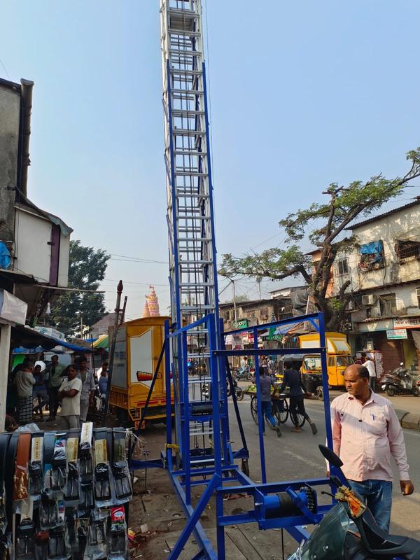 Aluminium Tiltable Tower LadderAn aluminum tiltable tower ladder is a specialized type of ladder designed for use in environments where the ground is not level, such as on a slope or on uneven terrain. This type of ladder is designed to be used in situations where traditional ladders may be unsafe or unstable.The tiltable tower ladder is made up of several sections that can be stacked on top of each other to create a tall tower. Each section has rungs or steps for climbing, as well as safety rails and braces to keep the ladder stable and secure. The base of the ladder is designed to be adjustable, allowing it to tilt to accommodate uneven ground.This type of ladder is particularly useful in construction, maintenance, and repair industries where access to hard-to-reach areas is required. It can be used to work on buildings, roofs, and other tall structures. The tiltable feature allows workers to position the ladder safely and securely, even on sloping surfaces.Available size : 12 to 60 feetPlatform size : 1.5'x1.5'Wheel no: 4 with 4 mechanical jacksRope size : 6mmBase : MS( SIZE : 8'X6'approx)Material : AluminiumThickness : 3 mm