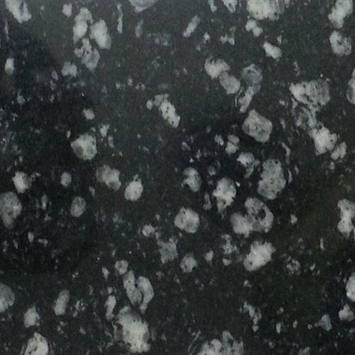 Coin Black Granite is a kind of black granite quarried in India. This exotic stone presents a deep black background flecked with thick droplets of silver colour in various sizes. Because of its natural appearance, this granite is suitable for exterior flooring and wall cladding, as well. With its unique arrangement of specks, it glorifies the space and hence, it is used for lining the front of the fireplace and also for designing the tabletops, or kitchen countertops.