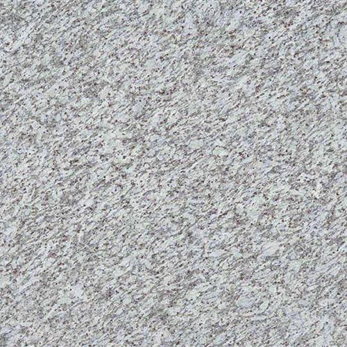 Jasmine White Granite is a low variation white granite from India. This granite has a white background with grey and purple very small flowers in the pattern. This stone is especially good for Exterior – Interior wall and floor applications, monuments, countertops, mosaic, fountains, pool and other design projects. We are one of the best suppliers and manufacturers of the White Jasmine Granite all over India at a pocket-friendly price.