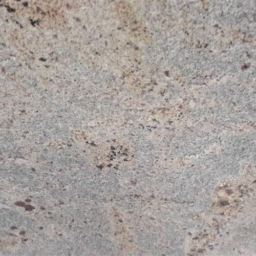 Kashmir Gold is a medium-grained, golden colour with red garnets granite quarried in India. The warm gold base colour with shades of grey and brown veining gives this natural stone a unique luxury look and feel. Ideal for a variety of uses both in the home and business, this reasonably priced stone is hard-wearing and easy to maintain. Kashmir Gold is ideal if you wish to add a warm and elegant finish to your kitchen.