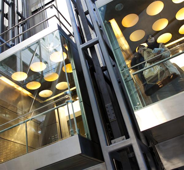 Hydraulic ElevatorsHydraulic elevators are heavy-duty elevators built for frequent, long-term use. They also have an ultra-smooth ride quality and are typically very quiet. They are one of the best elevators for durability, larger weight capacities, and serving a higher number of floors.The system operates with a hydraulic pump connected to a cylinder that raises and lowers a piston to move the elevator cab. The elevator will lift under the pressure of the hydraulic fluid pumped into the cylinder when a call button is pressed from a higher floor.To travel in the down direction, the controller will open a valve in the hydraulic tank, slowly releasing this pressure after a lower floor call has been placed. Since this type of elevator can travel down by simply opening a control valve and pull from gravity, it is also what makes them efficient in the use of power. They can even be lowered by battery backup in the event of a power failure with automatic operation.