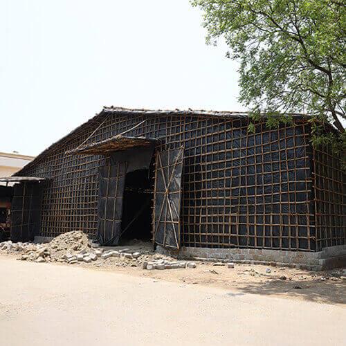 Temporary Storage Sheds are a conventional and reliable option for various industries looking to meet their immediate storage needs. Made from durable bamboo and wooden poles, these sheds can be easily assembled in any size, making them the perfect solution for temporary storage requirements. With their size flexibility and effective protection, Temporary Storage Sheds offer an affordable solution to all your storage needs without compromising on quality.\TEMPORARY STORAGE SHEDS FEATURESDurable: Temporary storage sheds are designed to withstand adverse weather conditions and are built with sturdy materials, ensuring they can last for an extended period.Relocability: Temporary storage sheds are designed to be portable, allowing them to be moved to different locations as needed.Ease of Maintenance: Temporary storage sheds are typically easy to maintain, requiring only occasional cleaning and minimal repairs.TEMPORARY STORAGE SHEDS APPLICATIONSTo provide shelter and protection for vehicles, equipment, and machinery at construction sites or outdoor eventsTo store and organise inventory and supplies for retail or warehouse operationsTo create an additional workspace for industrial or manufacturing processesTo House temporary offices or break areas for outdoor projects or eventsTo Provide shelter for livestock or agriculture equipmentFor emergency shelter during natural disasters or humanitarian crises