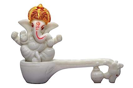 Size:- 4 Inch Color:- Marble, Material:- PolyresinLord Ganesh is worshiped before the beginning of any event and is known as remover of obstaclesIdeal for ganesh idol,showpieces for home décor,showpiece for living room,showpiece for gift,ganesh ganpati ganesha idol murti for home and giftingThis is a hand crafted product which glows at night and has been conceptually made as per vastu recommendations.This sophisticated and Elegant ganesha statue is uniquely handmade by skilled professionals.