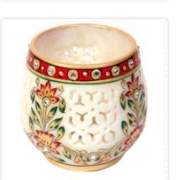 This is an elegantly decorated candle stand carved out of marble & beautiful artwork done using KGM Stone.