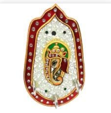 Place your keys in this beautifully designed Ganesha key holder and enhance the decor of your home.This is an elegant key organizer carved out of marble. It will enhance the look of the key and add to the decor of your home. Hand painted Ganesha in center crafted of meenakari & stone artwork make it a perfect home decor wall hanging. Best diwali gifts for employees under 500 or return gifts for grahpravesh or wedding favors or retirement gifts India!