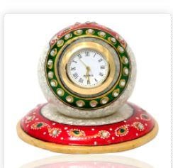 This elegant marble handicrafts paperweight clock with beautiful meenakari work & decorate your home or office space.Home decor can be enhanced with useful items like this elegant clock. This diwali bring home this beautiful Marble Paperweight style clock with beautiful meenakari work. It can be useful as well as a handmade decorative item for your drawing room. Gift this exclusive item to people you care about and get appreciated for your choice. Best as office gifts or showpiece for center table!