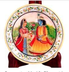 This decorative marble plate with Radha Krishna figure is sure to add to the grace and beauty of any wall decor with its mere presence.The decorative marble plate with Radha Krishna figure features an intricate painting of the divine couple, Radha and Krishna, at its center to make it highly desirable among their ardent devotees. Moreover, the delicate floral patterns present all along the border part of this decorative marble plate adds to its beauty, and make it the perfect choice for adding to the allure of any wall decor and to be gifted as puja return gifts. This marble plate will add both piety and grace to any household it adorns.