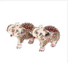 The extensive meenakari beadwork over this entire Rajasthani handicraft of these creatures carved from pure white marble adds to the elegance of the piece.This pair of marble handicrafts elephant showpiece look like having come right from the personal collection of a royal person. The extensive beadwork over the entire body of these creatures carved from pure white marble adds to the elegance of the piece which is further decorated with the dark red and golden colors. Perfect for a showpiece for drawing-room!
