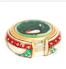 Adding to the magnificence of the set is the marble container featuring exquisite minakari works and adorned with dazzling beads at strategic places, making it a great handmade decorative item.The beauty of this 6 piece marble handicrafts tea coaster lies obviously in the brilliantly hand-painted peacock with its feather open. Adding to the magnificence of the set is the marble container featuring exquisite minakari works and adorned with dazzling beads at strategic places, making it a great handicraft decorative item. Best traditional Indian gifts!