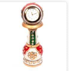 The beads that adorn the handmade decorative item further add to the magnificence of this marble meenakari artwork.Be it the dual-colored circular encasing of the marble clock placed on top of the pillar or the bold and bright colors of the meenakari work, every aspect of this beautiful handicraft watch is simply mesmerizing. The beads that adorn the various parts further add to the magnificence of this artwork. Best return gifts!
