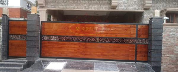 M-CRAFTWOODEN SLIDING MAIN GATE AND WICKET GATE WITH MS-HOT DIP GALVANIZATION AND MRF PU PAINT FINISHING.