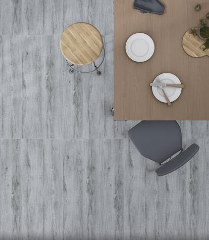 10018 Wooden Vitrified Tiles, size 200x1000mm, exude timeless beauty with their wood-like appearance. A perfect choice for adding a touch of nature to any space.