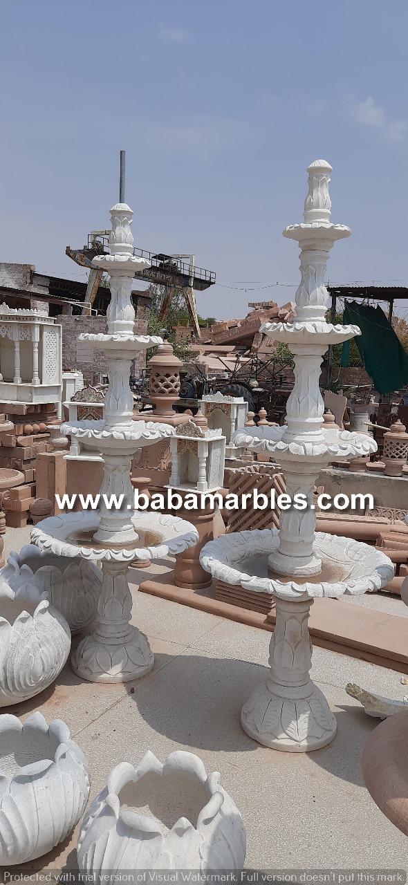 The Jodhpur Sand Stone Fountain is a stunning and captivating piece of architectural and artistic craftsmanship that embodies the rich heritage of Jodhpur, a city celebrated for its traditional stone work in India. Carved from the region's famed sandstone, this fountain is a magnificent example of the city's expertise in stonework. The intricately designed fountain features a combination of traditional and contemporary motifs, all intricately etched into the stone. Water gracefully flows from the fountain, creating a soothing and visually appealing display. The natural hues and textures of the sandstone give the fountain a warm and earthy character, making it a perfect addition to gardens, courtyards, or even indoor spaces. This Jodhpur Sand Stone Fountain not only serves as a functional water feature but also serves as a work of art that reflects the timeless beauty and cultural significance of Jodhpur's stone craftsmanship. It adds an elegant touch of tradition and serenity to any environment, making it a remarkable centerpiece that captures the essence of Jodhpur's heritage.