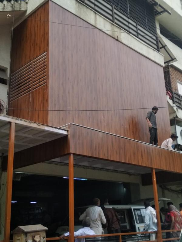  Modern wood front elevation tiles can be made from various wood materials, such as hardwood or engineered wood. Hardwoods like teak, oak, or cedar are popular choices due to their durability and aesthetic appeal.Design and Finish: Contemporary Design ,Texture and Finish, Color Palette: Neutral Tones  ,Sizing and Patterns  Options, Durability and Maintenance: Weather Resistance ,Installation: Professional Installation ,Sustainability: Sustainable Sourcing ,Cost Consideration: Budget .