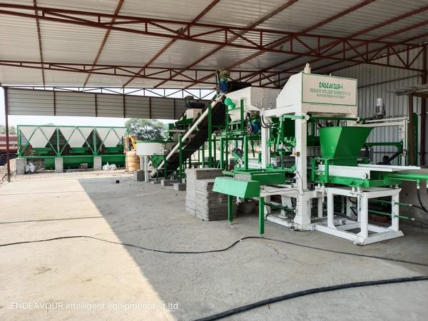 Hydraulic Vibro Compacting Concrete Blocks PlantMulti Product Machine to Produce Fly Ash Bricks, Cement Bricks, Concrete Solid Blocks, Concrete Hollow Blocks, Concrete Paver Blocks, Concrete Paver Blocks with Color Face etc…Model: ENDEAVOUR-iC5000Production Capacity: 24 Bricks per Stroke / 3500-4800 Bricks per HourStandard Bricks Size: 230 X 110 X 75 mm (Size Options Available)Vibration: Oil Filled Box Type High Speed Vibration Controlled by VFDPan Mixer Capacity: 1000 Kgs per Batch – 2 MixersHydraulic Tank Capacity: 250 LtrsControl Panel: User Friendly PLC Based Control Panel with Touch Screen DisplayPallet Size: 830 X 1100 X 32 mmConnected Power: 131.00 HP / 98.25 KW / 3 Phase / 440 Volts / 50 HtzDetails & Specifications are subjected to change without Prior Notice.Endeavour Intelligent Equipments Private Limited is Mehsana - Gujarat - INDIA Based Leading Engineering Company Offering Plant & Machinery Like Fly Ash Brick Plant, Fly Ash Brick Machine, Fly Ash Brick Making Machine, Fly Ash Brick Making Plant, Fly Ash Bricks Plant, Fly Ash Bricks, Machine, Fly Ash Bricks Making Machine, Fly Ash Bricks Making Plant, Automatic Fly Ash Brick Plant, Automatic Fly Ash Brick Machine, Automatic Fly Ash Brick Making Machine, Automatic Fly Ash Brick Making Plant, Automatic Fly Ash Bricks Plant, Automatic Fly Ash Bricks Machine, Automatic Fly Ash Bricks Making Machine, Automatic Fly Ash Bricks Making Plant, Fully Automatic Fly Ash Brick Plant, Fully Automatic Fly Ash Brick Machine, Fully Automatic Fly Ash Brick Making Plant, Fully Automatic Fly Ash Bricks Plant, Fully Automatic Fly Ash Bricks Machine, Fully Automatic Fly Ash Bricks Making Machine, Fully Automatic Fly Ash Bricks Making Plant, Concrete Block Plant, Concrete Block Machine, Concrete Blocks Plant, Concrete Blocks Machine, Automatic Concrete Block Plant, Automatic Concrete Block Machine, Automatic Concrete Blocks Plant, Automatic Concrete Blocks Machine, Automatic Concrete Block Making Plant, Automatic Concrete Block Making Machine, Automatic Concrete Blocks Making Plant, Automatic Concrete Blocks Making Machine, Fully Automatic Concrete Block Plant, Fully Automatic Concrete Block Machine, Fully Automatic Concrete Blocks Plant, Fully Automatic Concrete Blocks Machine, Fully Automatic Concrete Block Making Plant, Fully Automatic Concrete Block Making Machine, Fully Automatic Concrete Blocks Making Plant, Fully Automatic Concrete Blocks Making Machine, Concrete Hollow Block Making Plant, Concrete Solid Block Making Plant, Concrete Hollow Block Making Machine, Concrete Solid Block Making Machine, AAC Blocks Plant, Light Weight Concrete Blocks Plant, Autoclaved Aerated Concrete Blocks Plant, Autoclaved Aerated Concrete Blocks Manufacturing Project etc