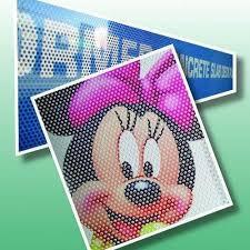 One-way vision vinyl is a specialized type of vinyl material used for signage and advertising purposes. It's often applied to windows or glass surfaces, allowing people inside to see out while presenting a graphic or advertisement to those outside. The material achieves this effect through micro-perforations: tiny holes that are small enough to be nearly invisible from a distance but still allow light to pass through.This material is popular for storefronts, vehicle windows, and other locations where businesses want to advertise without obstructing the view from inside. It's commonly used for large-scale advertisements, such as building wraps or bus wraps, where the one-way vision effect can be particularly striking.