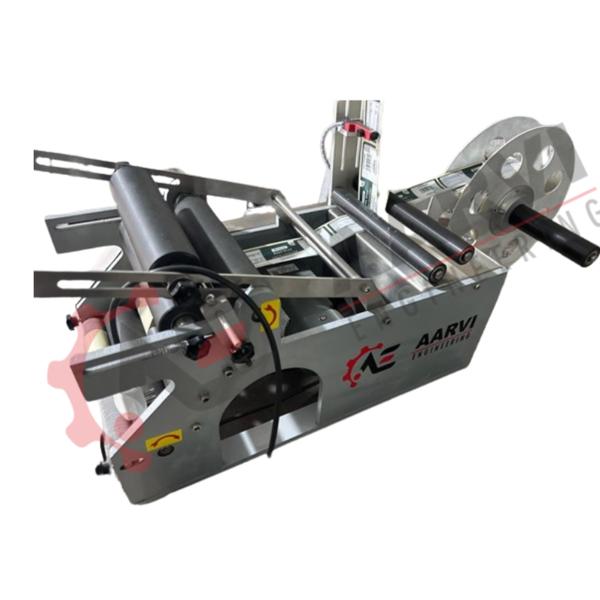 Introducing the table-top, compact, lightweight, and attractive semi-automatic Round Bottle sticker labelling machine, a solution designed specifically for the immaculate labelling of round bottles, jars, and containers.Its lightweight build promotes portability, enabling simple setup and relocation, and it is designed to thrive in a variety of applications. With this clever design, your labelling procedure will be optimized and will fit in with any workspace with ease.Learn about the uses of our semi-automatic labelling machine in a variety of industries, such as lubricants, cosmetics, agrochemicals, food and beverage, medicines, and distilleries. For bottles, jars, and containers that are circular, this machine produces faultless results.Experience a labelling solution that is quick, precise, and stylish for different container sizes. Our portable, lightweight container labeller produces accurate, effective labelling outcomes. Aarvi Engineering’s innovative labelling solutions might help you improve your labelling procedure.• The Sticker Labeling Machine is created or produced in conformity with GMP guidelines.• The building is constructed of MS with SS 304 siding.• rigid construction that is vibration-free for trouble-free operation.• a semi-skilled operator can operate it.• Mechanism with a specific purpose for Label Release.• To dispense labels, use a dispensing unit.• Partial or full labelling is available.• Machine Appropriate for Round Products Like Vials, Bottles, Jars, Tins, Cans, and Containers.• Reel mechanism to suspend the roll with a 76 mm (3