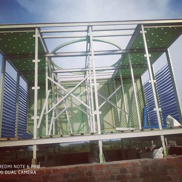 FRP PULTRUDED STRUCTURE COOLING TOWER.MADE BY FRP PULTRUDED SECTION LIKE ANGLES ,CHANNELS AND OTHER PROFILES .FRP PULTRUDED IS ENOUGH STRONG TO SUSTAIN FOR YEARS AFTER YEARS WITHOUT ANY MAINTIANANCE LIKE REPAINT OR OTHER .IT IS RUST PROOF,SOME ACID OR OTHER SOME SOLVENT PROOF.WHEN CHEMICAL COMPANY HAS ACID FUMES OR OTHER AIR IMPURITIES THEY SHOULD GO FOR FRP PULTRUDED STRUCTURES.