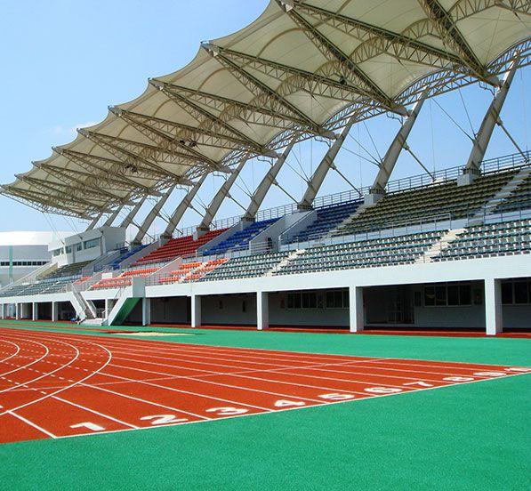 A stadium cover tensile structure is an architectural solution used to provide shelter and shade for spectators in sports stadiums. These structures are characterized by their use of tensioned membranes, typically made from materials like PVC-coated polyester fabric or PTFE-coated fiberglass fabric. The main features and benefits of tensile structures for stadium covers include:Key FeaturesMaterial:PVC-coated Polyester: Durable, flexible, and cost-effective. Often used for temporary or semi-permanent structures.PTFE-coated Fiberglass: Highly durable, resistant to UV radiation, weather, and fire. Suitable for permanent structures.Design Flexibility:Shapes and Forms: Tensile structures can be designed in various shapes, such as saddle, cone, or hypar (hyperbolic paraboloid), allowing for innovative and aesthetically pleasing designs.Transparency: Some membrane materials allow light to pass through, reducing the need for artificial lighting during the day.Structural Efficiency:Lightweight: These structures are much lighter than traditional roofing systems, reducing the load on the supporting framework and foundations.High Strength-to-Weight Ratio: The tensile nature of the materials allows them to cover large spans with minimal support, providing unobstructed views.Durability and Maintenance:Longevity: High-quality tensile materials can last for decades with minimal maintenance.Self-Cleaning: Some membrane materials have self-cleaning properties, reducing the buildup of dirt and debris.BenefitsAesthetic Appeal:Tensile structures can create visually striking architectural forms, enhancing the overall look of the stadium.Environmental Considerations:Energy Efficiency: By allowing natural light to penetrate, these structures can reduce energy consumption for lighting.Sustainability: Materials like PTFE-coated fiberglass can be recycled, contributing to the sustainability of the project.