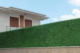 😊Here's another rewritten text without bullet points:Artificial Grass Fence with Total FenceTotal Fence offers innovative artificial grass fencing, blending the natural beauty of grass with the durability of synthetic turf. This unique solution enhances your outdoor space's aesthetic appeal while providing a secure boundary.Our artificial grass fencing features premium materials, ensuring a vibrant and realistic appearance that endures. The artificial grass is securely attached to a sturdy fence backing, creating a robust and long-lasting boundary. Our expert team collaborates with you to craft a customized solution tailored to your specific needs.With Total Fence's artificial grass fencing, you can rely on a hassle-free and functional solution for your outdoor space. Our fencing is easy to install and maintain, withstanding harsh weather conditions with ease. It's an ideal choice for residential, commercial, and industrial properties, offering a stylish and secure boundary solution.Total Fence's artificial grass fencing is perfect for creating a stunning and natural-looking boundary without the maintenance requirements of real grass. Our team works closely with you to design a customized fence that meets your unique needs, ensuring a beautiful and functional finish.