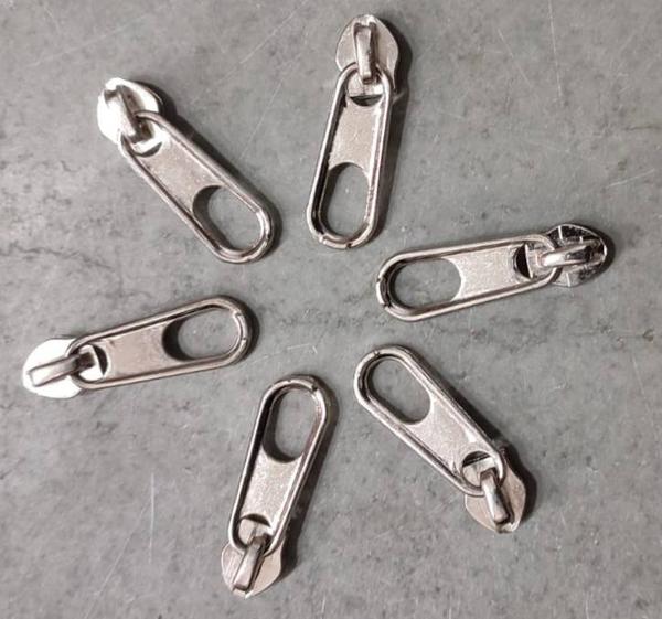 Product DescriptionWith very long years of experience in this realm, we are engaged in proffering world class array of THUMB SHAPED DESIGN FANCY SLIDERS . They are handy and available in many size options. Features: Sturdy and durableResistant to breakageCan withstand high impactMetal finishedMany sizes availablePerfect finishFrom our new collection, we are offering our clients an astonishing collection of zippers,brass zippers fibre zippers,etc. The optimum quality raw material is procured from the reliable vendors of the market to manufacture these zippers in adherence with set industry standards and norms. We offer these zippers in various designs, shapes, sizes and colors to meet the variegated requirements of our respected customers. Our products are widely demanded for high strength and durability.