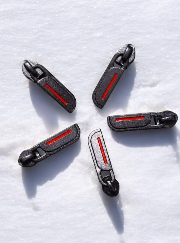 This set of black and red zipper pulls are a perfect solution for broken or missing zipper tabs. They are made of durable metal and feature a sleek design with a red accent. These pulls are easy to attach and can be used on a variety of items, including luggage, backpacks, jackets, and more