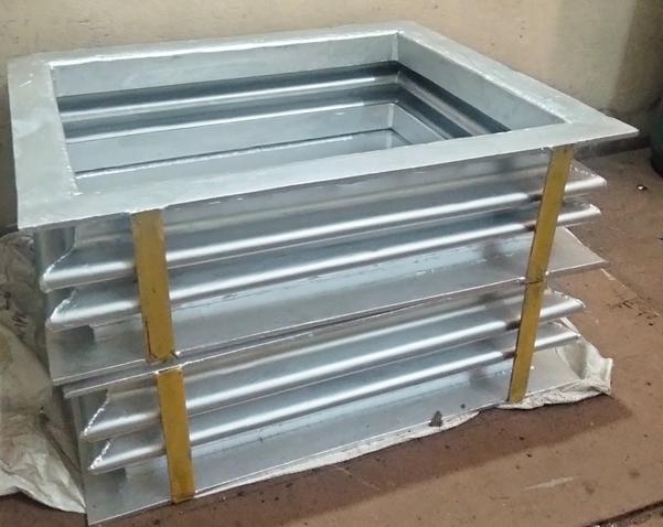 Excel Bellows in Vadodara offers Stainless Steel Rectangular Bellows, which are specifically designed to accommodate movement and absorb vibrations in rectangular piping and ducting systems. These bellows are essential in maintaining the integrity and efficiency of various industrial applications.Key Features of Stainless Steel Rectangular Bellows by Excel Bellows:Material:Constructed from high-quality stainless steel, offering excellent corrosion resistance, strength, and durability.Common grades used include 304, 316, and 321, each selected based on the application requirements such as temperature, pressure, and chemical exposure.Design:The rectangular shape is tailored for easy integration into rectangular ducts or piping systems.Designed with multiple convolutions, these bellows effectively absorb axial, lateral, and angular movements, reducing stress on connected equipment.Applications:Widely used in industries such as chemical processing, oil and gas, power generation, HVAC systems, and food and beverage.Ideal for systems where vibration isolation, thermal expansion compensation, and pressure containment are crucial.Performance Capabilities:Capable of withstanding high pressures and temperatures, ensuring reliable performance in demanding environments.Provides a leak-proof seal, preventing the escape of gases or liquids during operation.Customization Options:Excel Bellows offers customization for stainless steel rectangular bellows, allowing clients to specify dimensions, pressure ratings, and movement capabilities.Options for multi-ply designs are available to enhance flexibility and durability in extreme applications.Durability:Designed for long-term use, these bellows resist wear and fatigue, ensuring reliable performance over time.Their robust construction protects against structural damage caused by thermal expansion or mechanical vibrations.Ease of Installation:Available with various end configurations, including flanged, welded, or threaded, facilitating easy integration into rectangular ducting and piping systems.The lightweight nature of the stainless steel makes handling and installation efficient.Quality Assurance:Excel Bellows follows strict quality control measures to ensure that all stainless steel rectangular bellows meet international standards for performance, safety, and durability.