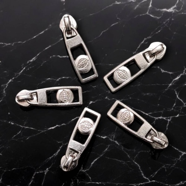 Fancy Slider In 8 No & 10 Available In Nickel, black nickel, golden & can customizeed All Colours.Colours:- All & can be customisable Guaranteed period:- 5 Years With very long years of experience in this realm, we are engaged in proffering world class array of global Zipper Slider. They are handy and available in many size options. Features:Sturdy and durableResistant to breakageCan withstand high impactMetal finishedMany sizes availablePerfect finishFrom our new collection, we are offering our clients an astonishing collection of zippers,brass zippers fibre zippers,etc. The optimum quality raw material is procured from the reliable vendors of the market to manufacture these zippers in adherence with set industry standards and norms. We offer these zippers in various designs, shapes, sizes and colors to meet the variegated requirements of our respected customers. Our products are widely demanded for high strength and durability.