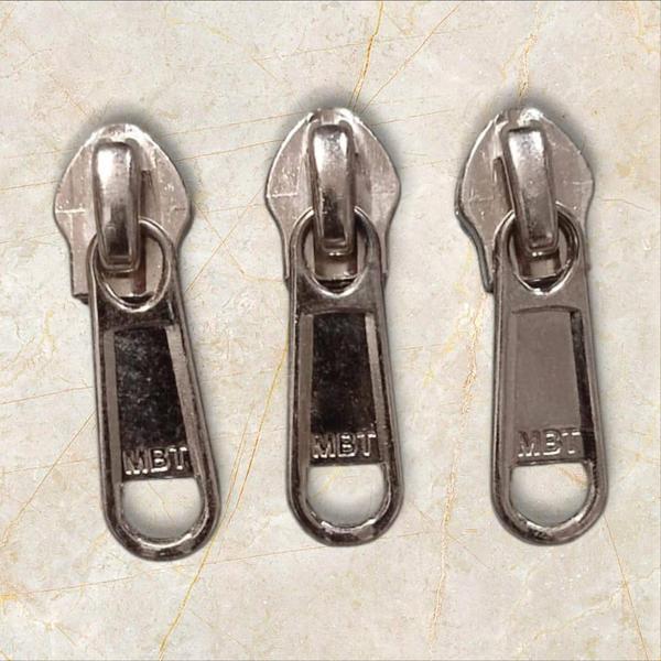 High quality fancy slider with 5 years guaranteed.A zipper consists of two strips of material with metal or plastic teeth along the edges and with a sliding piece that draws the teeth into interlocking position when moved in one direction and separates them again when moved in the opposite direction.With very long years of experience in this realm, we are engaged in proffering world class array of Zipper Slider. They are handy and available in many size options. Features:Sturdy and durableResistant to breakageCan withstand high impactMetal finishedMany sizes availablePerfect finishFrom our new collection, we are offering our clients an astonishing collection of zippers,brass zippers ,etc. The optimum quality raw material is procured from the reliable vendors of the market to manufacture these zippers in adherence with set industry standards and norms. We offer these zippers in various designs, shapes, sizes and colors to meet the variegated requirements of our respected customers. Our products are widely demanded for high strength and durability.
