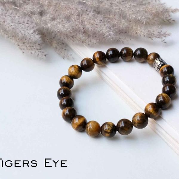 A very strong protection crystal, Tiger eye is formed in many a variations. No matter which form of tiger eye it may be, it is a amazing protection and grounding crystal. This helps in grounding excessive energies and also stimulates all three base chakras. It prompts one to take decisions and action. It is very effective for protection against evil energies and psychic attacks.Additional Information:8mm genuine gemstone beads Strung on durable stretchy cord Unisex Sizing Stone colors may vary Shipping time 5 working days minimum