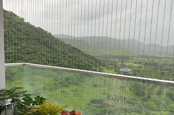 Invisible Grills are a modern solution for bird control and safety in residential and commercial buildings. They offer an effective way to keep birds away while maintaining an unobstructed view from balconies and windows.Key Features of Invisible Grills :Material: Typically made from high-tensile stainless steel wire or nylon strands, invisible grills are designed to be both strong and durable. They are resistant to rust and weather conditions, ensuring longevity.Design: The grills are nearly invisible when installed, providing a clean aesthetic without compromising the view. This makes them particularly appealing for high-rise buildings and urban environments where visual appeal is important.Functionality: Invisible grills serve dual purposes: they act as a barrier against birds, preventing them from nesting or perching, and they enhance safety by preventing falls, especially in homes with children or pets.Installation: These grills can be installed in various configurations, including fixed or sliding options, making them versatile for different architectural designs.Benefits :Aesthetic Appeal: Unlike traditional bird control methods like nets or spikes, invisible grills maintain the beauty of the property by being discreet.Safety: They provide a safety barrier that prevents accidental falls from balconies and windows, which is crucial in high-rise living.Low Maintenance: Once installed, invisible grills require minimal upkeep compared to other bird control solutions, as they do not accumulate debris like nets might.Cost-Effectiveness: While the initial investment may be higher than other options like bird nets, their durability and low maintenance can lead to cost savings over time.