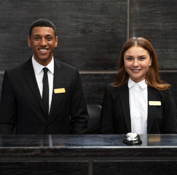 HOTEL UNIFORM MANUFACTURER IN AHMEDABADAt Amit Uniform, we specialize in crafting premium-quality Front Desk/Reception Uniforms designed to make a lasting impression. As the face of your organization, reception staff play a crucial role in reflecting your brand’s professionalism and hospitality.Our uniforms combine elegance, comfort, and functionality, ensuring your front desk team feels confident and comfortable throughout their workday.Key Features of Our Front Desk/Reception Uniforms:Sophisticated Designs: Tailored to suit a professional environment with a polished and welcoming appearance.Premium Fabrics: Made from high-quality materials for durability, comfort, and easy maintenance.Custom Fit: Options for customized fittings to ensure the perfect look and feel for every team member.Brand Personalization: Logo embroidery and color coordination to match your organization's branding.Versatile Styles: Available in formal suits, blazers, skirts, trousers, and shirts for men and women.Elevate your organization’s first impression with Amit Uniform’s exceptional Front Desk/Reception Uniforms. Our designs not only enhance professionalism but also reflect the unique identity of your brand.Contact us today to explore our range and discover how we can customize the perfect uniform solution for your team.