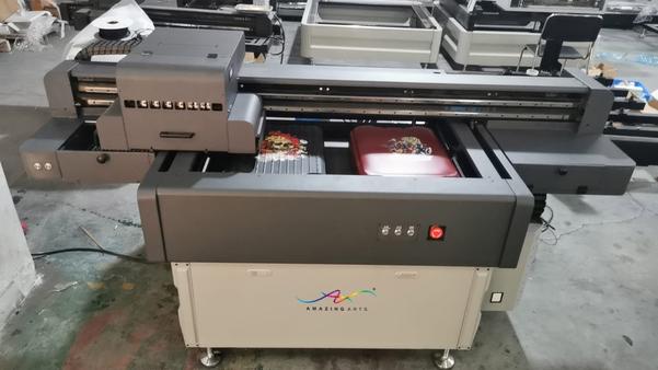 M9060 UV Printing MachineAppearance : Black grey + medium greyPrint: Ricoh GEN5i/i3200u/XP600(1-4)Rail : Double railColor : CMYK+Lc+Lm+White+VarnishFlat bed size(mm) : 940 x 640Print Thickness(mm) : Plate printing thickness0.1mm-380mm Cylinder print diameter 20mm-200mm (Ultra-high customizable)Curing System : LED UV LightsImage Format : TIFF/JPG/EPS/PDF/BMPRip Software : PHOTOPRINT/Maintop/Riin Rip-honsonNegative pressure : White and color separate negative pressurePower Supply : AC220V 50HZ ±10%Temperature : 20-32°CHumidity : 40-75%Power : 2500WAppearance Size (mm) : Length/width/height:2065/1180/1005Data Transmission : TCP/IP network interfaceNet Weight(kg) : 400Wooden box size(mm) : 2520X1550X1410Suction system : 750W brand fansY-axis : Servo motor driveLead screw : Imported brand double Y screwAutomatic height measurement : The system drives the automatic height measurement function