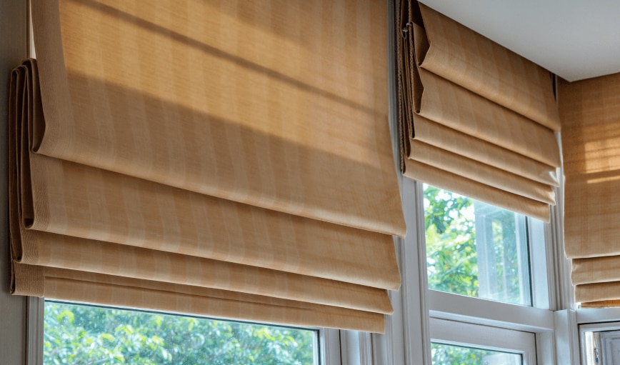 Roman blinds are elegant window coverings that combine style and functionality. Made from fabric that folds into soft pleats when raised, they offer a clean and sophisticated look. Available in various colors, textures, and patterns, Roman blinds are perfect for adding warmth and privacy to any room while providing excellent light control and insulation.