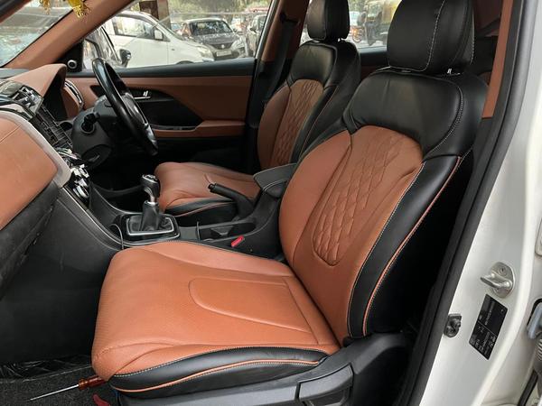 A car seat cover is a protective accessory designed to fit over your vehicle's seats. It serves various purposes, including:1. Protection: Covers shield seats from spills, stains, dirt, pet hair, and UV rays, helping to preserve the original upholstery.2. Comfort: Many covers add extra cushioning or breathability, enhancing the overall comfort during drives.3. Style: Available in a wide range of colors, patterns, and materials, seat covers can update or personalize the look of your car’s interior.4. Easy Maintenance: Most car seat covers are removable and machine washable, making it easy to clean and maintain them.5. Installation: Many are designed for easy installation, often using straps or elastic to ensure a secure fit.Common materials used include neoprene, leather, fabric, and faux leather, each offering different benefits in terms of durability and aesthetics. Some covers are universal, while others are custom-fit for specific vehicle models.