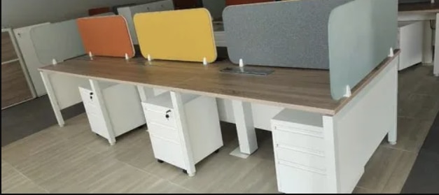 Modular Office Furniture Workstation Manufacturers in AhmedabadWe also supply in Ahmedabad, Amreli, Banaskantha, Bharuch, Bhavnagar, Dang, Jamnagar, Junagadh, Kheda, Kachchh, Mehsana, Panchmahal, Rajkot, Sabarkantha, Surat, Surendran agar and Vadodara.Seating Capacity	3 SeaterIs It Lockable	YesFrame Material	SteelTable Height	4 FtUsage/Application	Corporate OfficeTable Material	Wooden1) 25.mm Top All Side 2.mm PVC Edged Banding.2)50x50 Leg. TAI MEMBER3)18.MM MODESTY.4)30.MM SCREEN & 3 DRAWER PEDESTAL.5)COLOUR AS PER CUSTOMER REQUEREMENT.