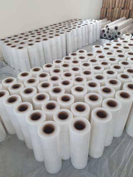 Stretch film, also known as stretch wrap, is a highly elastic plastic film used primarily for wrapping and securing items during storage or transportation. Made from linear low-density polyethylene (LLDPE), it is designed to stretch when applied, creating a tight and secure wrap around objects. Stretch film is commonly used in packaging industries to stabilize palletized goods, protect items from dust, dirt, and moisture, and reduce tampering.Key Features: • Elasticity: Provides excellent stretch and recovery properties, ensuring a tight hold. • Clarity: Often transparent, allowing easy identification of wrapped items. • Tear Resistance: Durable enough to resist punctures and tears during handling. • Thickness Options: Available in various gauges (thicknesses) for different load sizes and weights.Types of Stretch Film: 1. Hand Stretch Film: Applied manually, suitable for smaller operations. 2. Machine Stretch Film: Used with stretch-wrapping machines for larger-scale applications. 3. Pre-Stretched Film: Already stretched during manufacturing, reducing physical effort during application. 4. Colored/Opaque Stretch Film: For concealing contents or color-coding shipments. 5. UV Stretch Film: Provides UV resistance for outdoor storage.