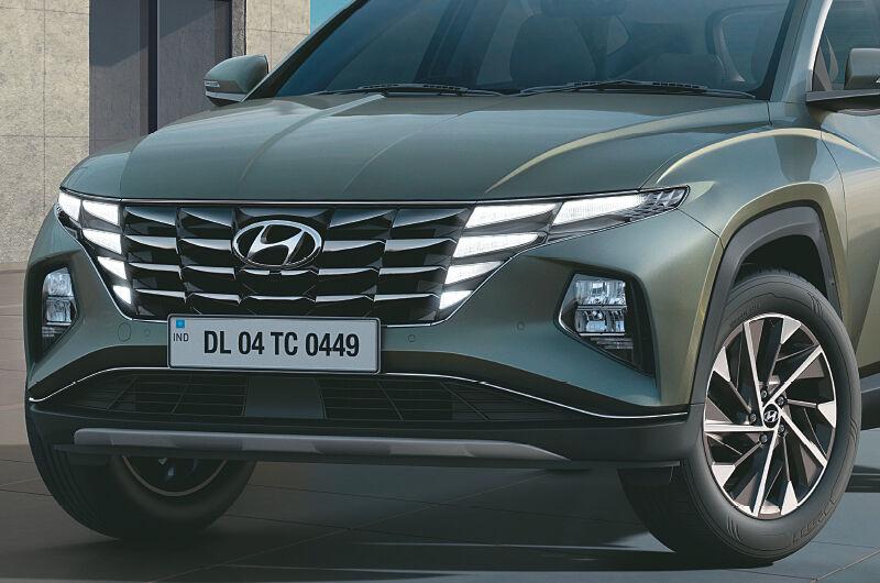 Hyundai TUCSON Car - Parametric, Progressive Design.The all-new Hyundai TUCSON is a revolution in design. Sophisticated and progressive, it’s the SUV taking modern aesthetics to the next level.Truly, the cutting-edge SUV design with advanced technology.Hyundai TUCSON Car Side Front ViewThe all-new Hyundai TUCSONThe all-new Hyundai TUCSON is a design revolution that has power to transform the perception of a premium SUV. Its head-turning and striking looks create an impressive yet bold road presence. The all-new Hyundai TUCSON is crafted to meet and exceed the aspirations of new age luxury seekers and those who actively embrace the integration of most advanced global technologies, stunning modern design and enthralling performance in their lifestyles.Epitomized to personify Revolutionary dynamism, Modern Elegance, Intelligent Technology and Future Readiness, the all-new Hyundai TUCSON has been conceptualized for achievers, who are always on the lookout for what they can do next. For this set of highfliers, the finish line is just the beginning and their ‘Next drives Now’. Through its unique facets and identity, the all-new Hyundai TUCSON is the perfect choice of mobility for customers.Iconic designDark Chrome Parametric Front Grille with Hidden DRLs & LED HeadlampsDark chrome parametric front grille with hidden DRLs & LED headlamps.Connecting LED Tail LampsConnecting LED tail lamps.Virtual CockpitVirtual cockpit.Premium Black and Light Grey Dual Tone InteriorsPremium black and light grey dual tone interiorsbanner 1banner 2Advanced infotainment & connectivity26.03 cm (10.25