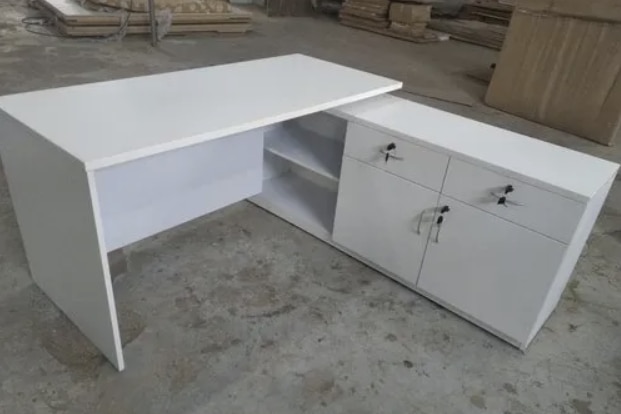 Wooden Laminated Office Table Manufacturers in AhmedabadWe also supply in Ahmedabad, Amreli, Banaskantha, Bharuch, Bhavnagar, Dang, Jamnagar, Junagadh, Kheda, Kachchh, Mehsana, Panchmahal, Rajkot, Sabarkantha, Surat, Surendranagar and Vadodara.Shape	RectangularStorage	With StorageSize / Dimensions	4x2 FeetStorage Type	Drawer StorageNo. of Drawers	3 DrawersColour	WhiteFinish Type	PolishedTable Height	3.5 FeetSuitable For	OfficeMaterial	WoodenOFFICE WORK STATION1)25.mm Top all said 2.mm edged banding .2)18.mm Vertical & 18.mm Modesty.3)3 Drawer Pedestal.4)Good quality hardware used & made with       particle board. 5)Colours as per the customer requrement.Additional Information:Delivery Time: 2 to 3 working days