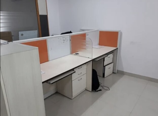 Modular Office Cubicle Manufacturers in AhmedabadWe also supply in Ahmedabad, Amreli, Banaskantha, Bharuch, Bhavnagar, Dang, Jamnagar, Junagadh, Kheda, Kachchh, Mehsana, Panchmahal, Rajkot, Sabarkantha, Surat, Surendranagar and Vadodara.Seating Capacity	4 SeaterModular Partition Thickness	18mm particalTable Top Thickness	25mmProduct Warranty	2yerasPartition Thickness	18mmTable Top Edge Banding	2mm all seidMaterial	AluminiumBeam structure	woodenfree standing workstation1)25. Mm top, all side 2. Mm pvc edged banding.2)partition on the  upper side of table top soft board & writing board with powder coating3)18. Mm verticle & 3 drawer pedestal4)18. Mm modesty5)use telecop channel & we gives electrical point.6)colours as per the customer requrement.Additional Information:Production Capacity: 1000Delivery Time: 25dey